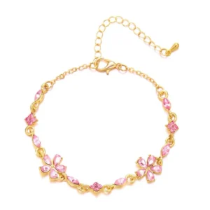 Bracelet doré avec cristaux et fleurs roses